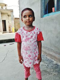 Portrait of cute girl standing outdoors