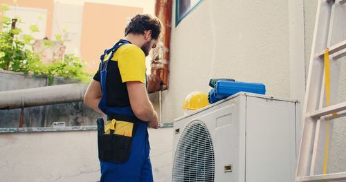 Side view of man working at home