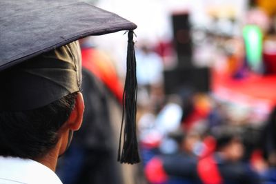 Rear view of man graduated 