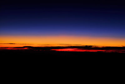 Scenic view of silhouette landscape against romantic sky at sunset