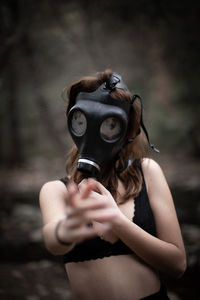 Woman wearing gas mask