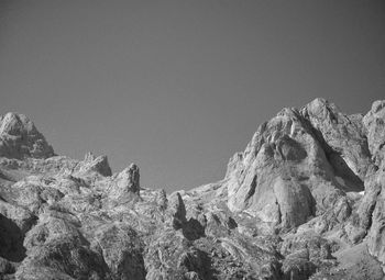 Low angle view of rock formation against clear sky
