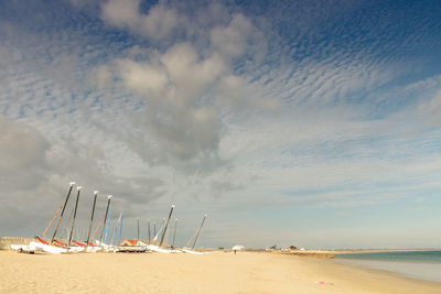 Sailboats on an empty sandy beach at gâvres in bretagne in morbihan