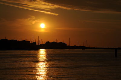 Silhouette of city at sunset