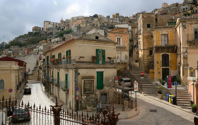 High angle view of street amidst buildings in town