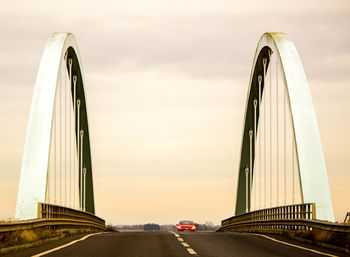 View of bridge against sky in city