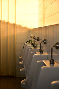 Urinals in row at public restroom