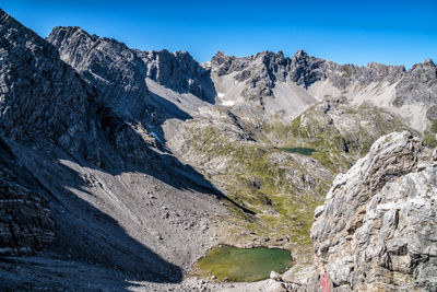 Scenic view of rocky mountains against clear sky