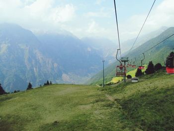 Scenic view of landscape against cloudy sky