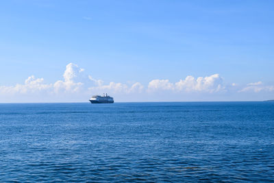 Scenic view of sea against blue sky