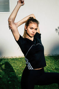 Young woman standing on field