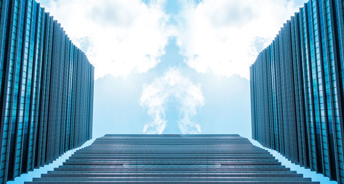 Low angle view of people walking on escalator