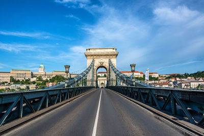 View of bridge against cloudy sky