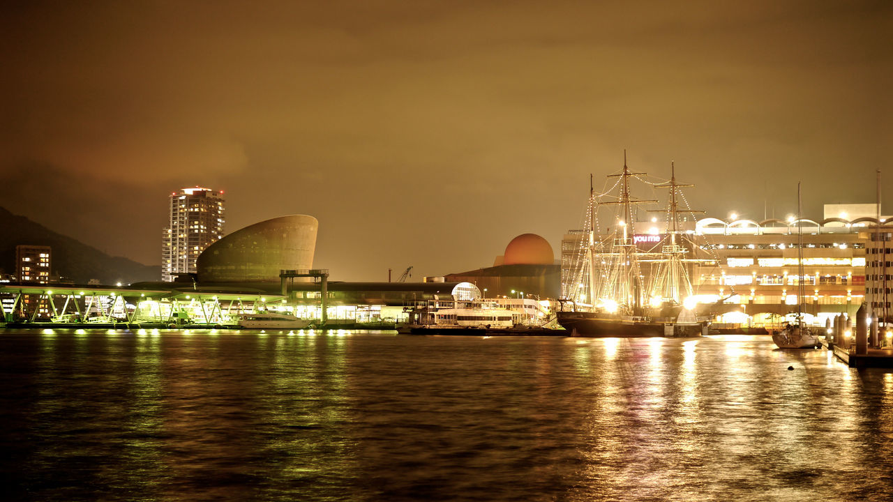 water, waterfront, nautical vessel, transportation, sea, built structure, architecture, illuminated, harbor, sky, reflection, boat, moored, mode of transport, building exterior, river, commercial dock, city, night, mast