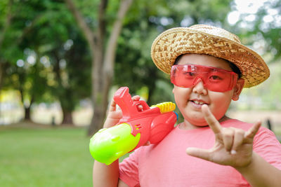 Portrait of smiling boy with toy