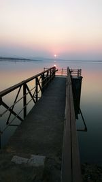 Scenic view of sea against clear sky during sunset