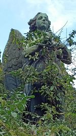 Low angle view of statue against sky