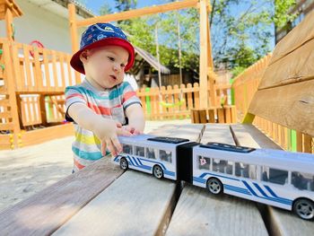 A little cute boy of one and a half years plays with toys at the playground. adorable toddler 