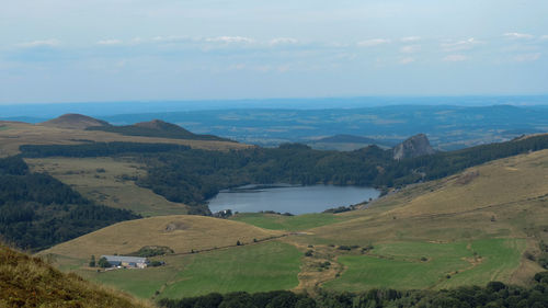 Scenic view of landscape and mountains against sky