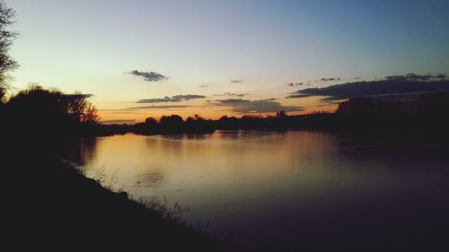 Scenic view of lake at sunset