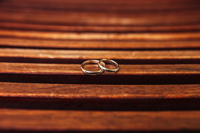 Close-up of wedding rings on table