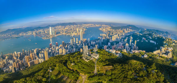 High angle view of buildings by sea against sky