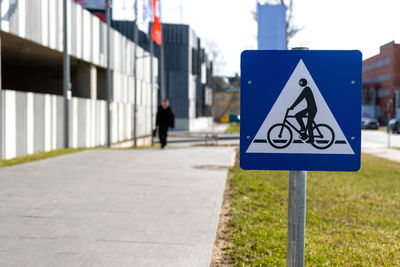 Road sign on street in city