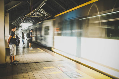 Blurred motion of train at railroad station