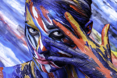 Close-up portrait of woman with body paint