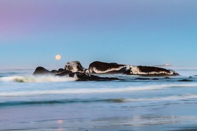Scenic view of sea against clear sky