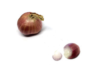 Close-up of fruit against white background