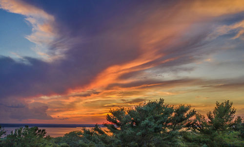 Scenic view of dramatic sky over sea during sunset