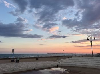 Scenic view of calm sea at sunset