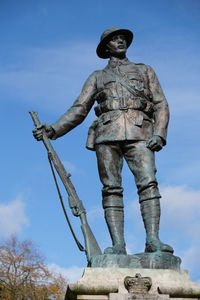 Low angle view of statue against sky