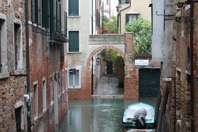 View of canal between buildings