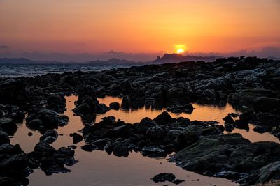 Scenic view of sea against sky during sunset