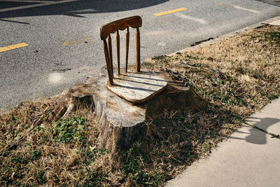 High angle view of empty bench on road