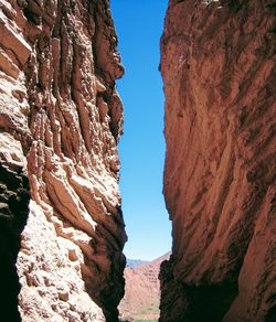 Low angle view of rock formations against sky