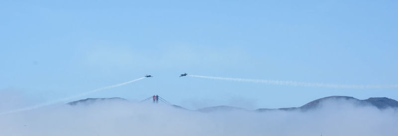 Scenic view of mountains against cloudy sky