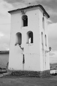 Low angle view of bell tower against sky