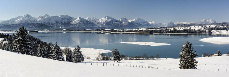 Scenic view of snow covered mountains against sky