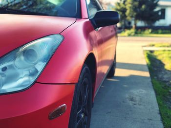 Red parked car on road