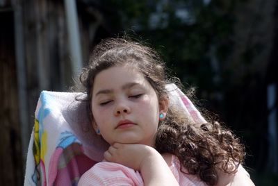 Girl napping in backyard