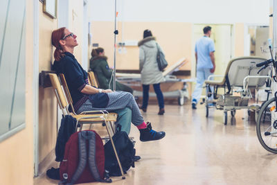 Woman sitting in hospital waiting room