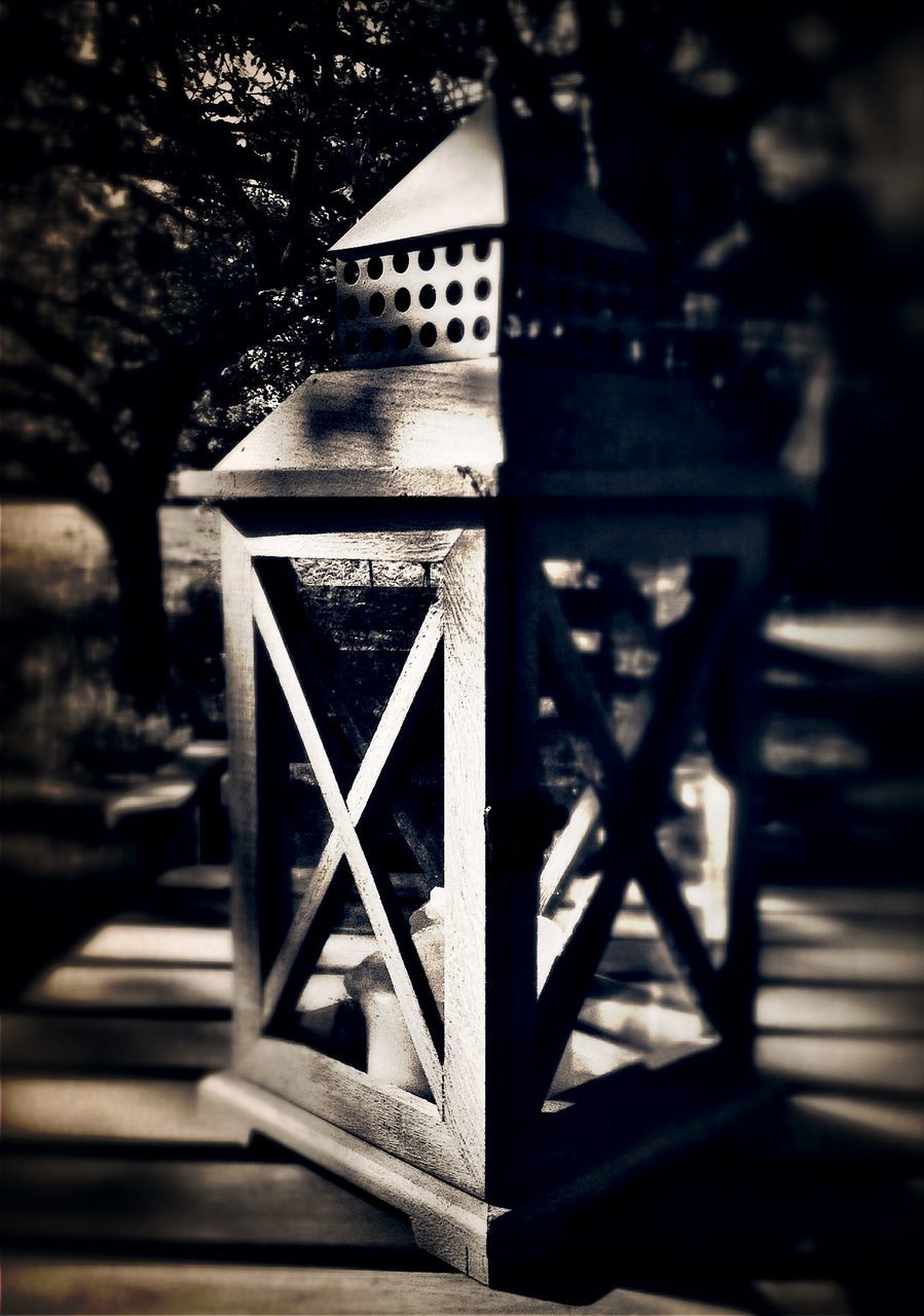 architecture, built structure, tree, building exterior, railing, sunlight, day, shadow, no people, metal, steps, gate, window, close-up, focus on foreground, outdoors, pattern, entrance, protection, wood - material