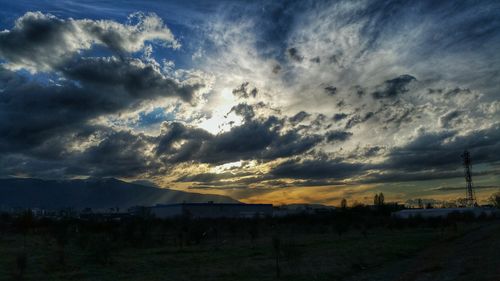 Scenic view of landscape against cloudy sky