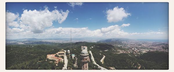 Cityscape against cloudy sky