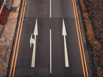 High angle view of road sign on street