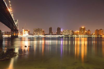 Illuminated city at waterfront