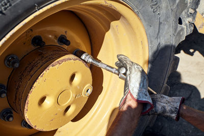 Cropped image of man repairing car
